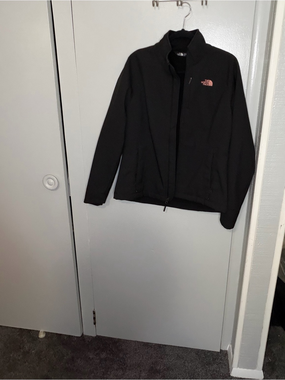 The North Face Men's Black Jacket with Pink Logo